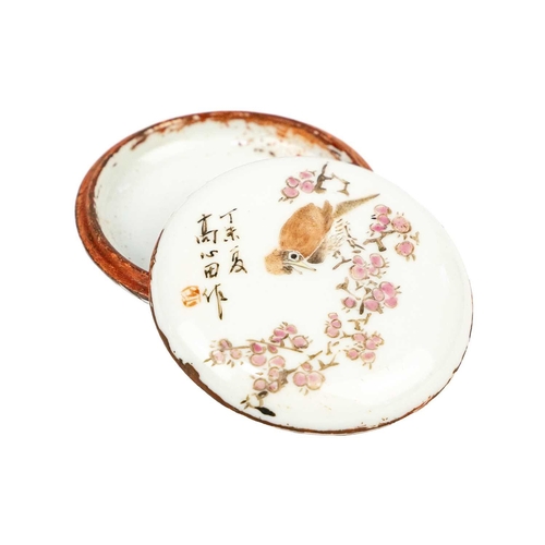 220 - A Chinese famille rose porcelain circular ink box. The cover with a bird perched on a branch, with c... 