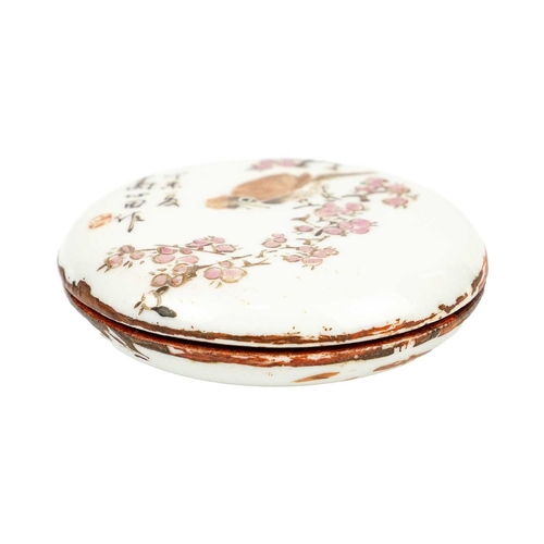 220 - A Chinese famille rose porcelain circular ink box. The cover with a bird perched on a branch, with c... 