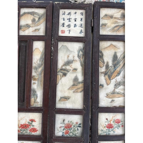 24 - A Chinese alabaster and hardwood seven paneled screen, Qing Dynasty, late 19th century. Painted with... 