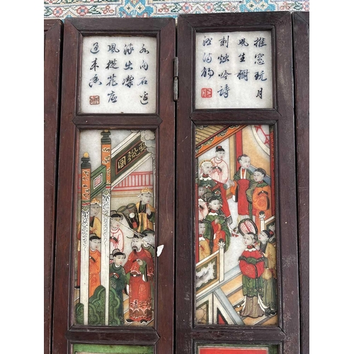 24 - A Chinese alabaster and hardwood seven paneled screen, Qing Dynasty, late 19th century. Painted with... 