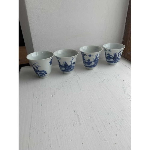 25 - A set of Chinese blue and white porcelain cups, covers and stands, 18th century. Late Kangxi period,... 