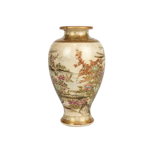 255 - A Japanese Satsuma vase, Meiji period. Gilt decorated with flowering trees and birds in a mountainou... 