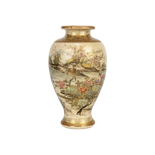 255 - A Japanese Satsuma vase, Meiji period. Gilt decorated with flowering trees and birds in a mountainou... 