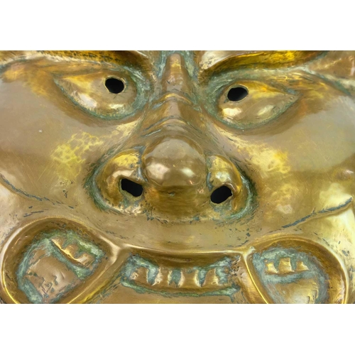 268 - A Japanese brass mask, Meiji period. 30 x 38cm.