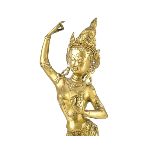 273 - A Tibetan brass figure of a dancing lady, 20th century. Height 47cm, width 14.3cm, depth 10.5cm.