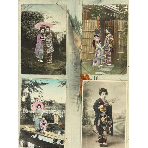 289 - A Japanese black lacquered and silk lined postcard album, early 20th century. Containing seventy-two... 