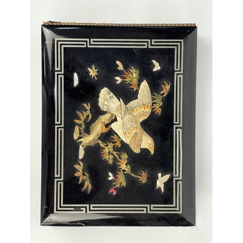 289 - A Japanese black lacquered and silk lined postcard album, early 20th century. Containing seventy-two... 