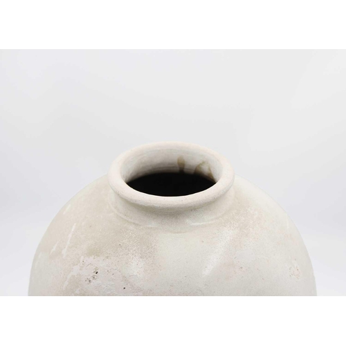 29 - A Korean pottery vase, Choson Dynasty. The ovoid body with a central line beneath a short flared rim... 