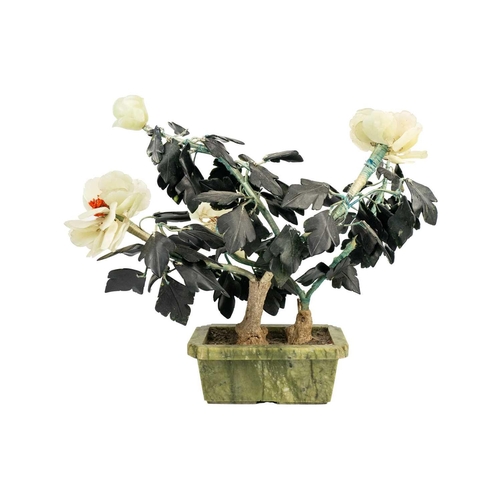 291 - A Chinese hardstone flowering plant, 20th century. Including two jade flowerheads, height 37cm, widt... 