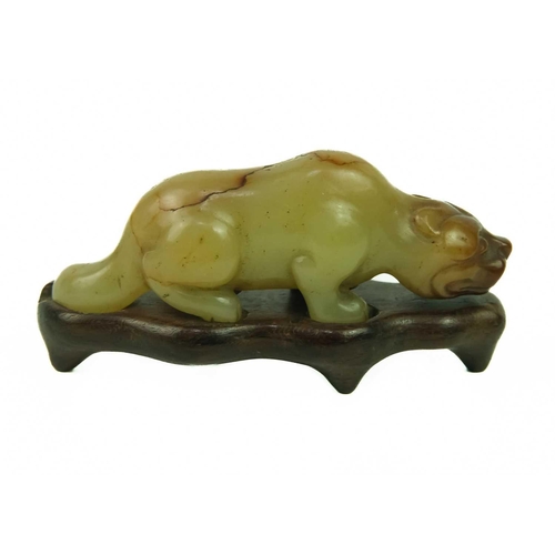 3 - A Chinese russet jade tiger, Qing Dynasty, 19th century. Height 3cm, length 7.3cm, depth 2cm, on a f... 