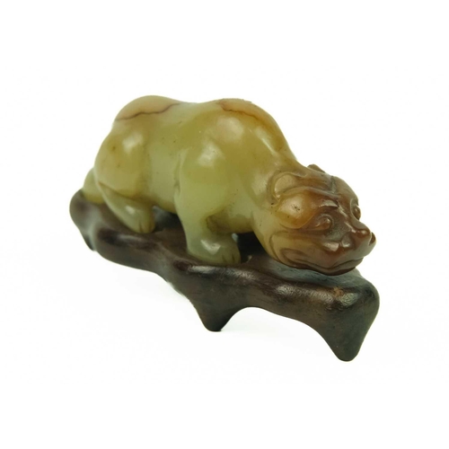 3 - A Chinese russet jade tiger, Qing Dynasty, 19th century. Height 3cm, length 7.3cm, depth 2cm, on a f... 