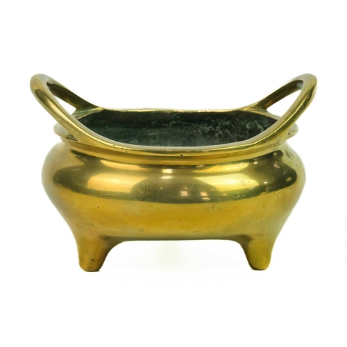 30 - A Chinese polished bronze censer, 18th/19th century. With a pair of looped handles, the underside wi... 