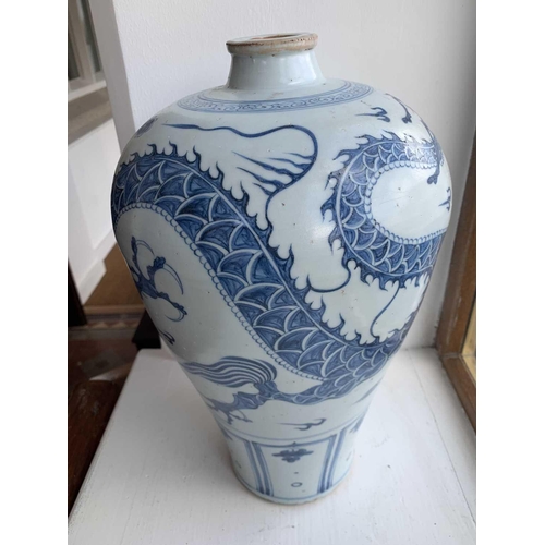 301 - A Chinese blue and white porcelain meiping, 20th century, in Yuan style, painted with a dragon among... 