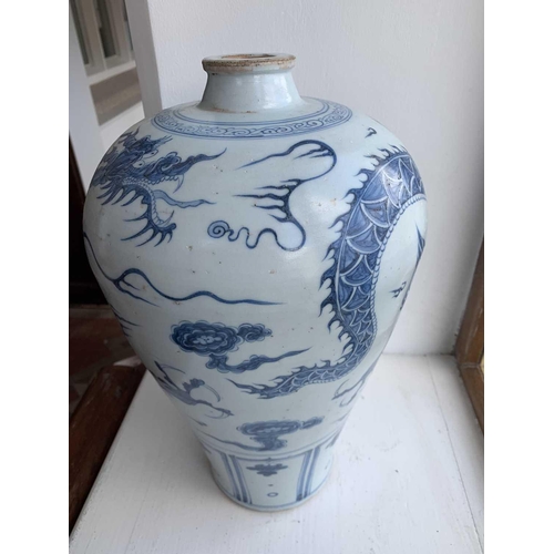 301 - A Chinese blue and white porcelain meiping, 20th century, in Yuan style, painted with a dragon among... 