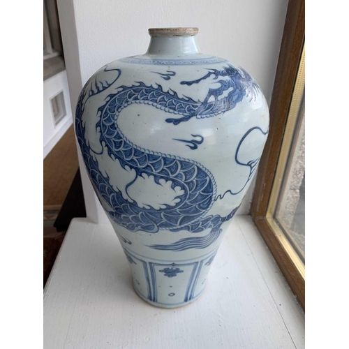 301 - A Chinese blue and white porcelain meiping, 20th century, in Yuan style, painted with a dragon among... 