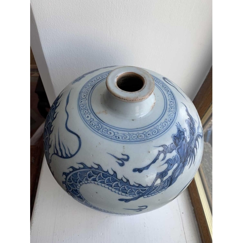 301 - A Chinese blue and white porcelain meiping, 20th century, in Yuan style, painted with a dragon among... 