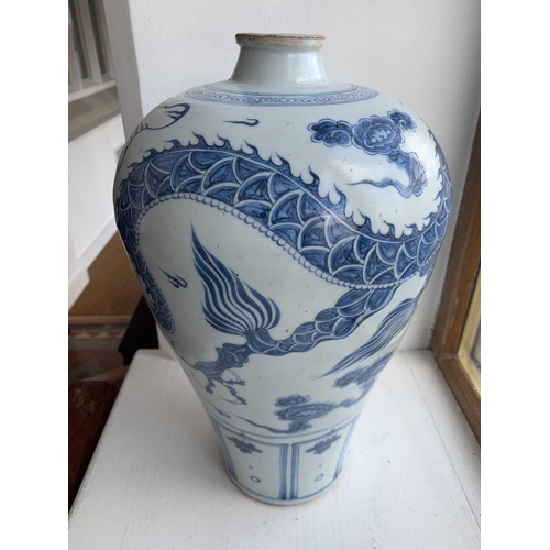 301 - A Chinese blue and white porcelain meiping, 20th century, in Yuan style, painted with a dragon among... 