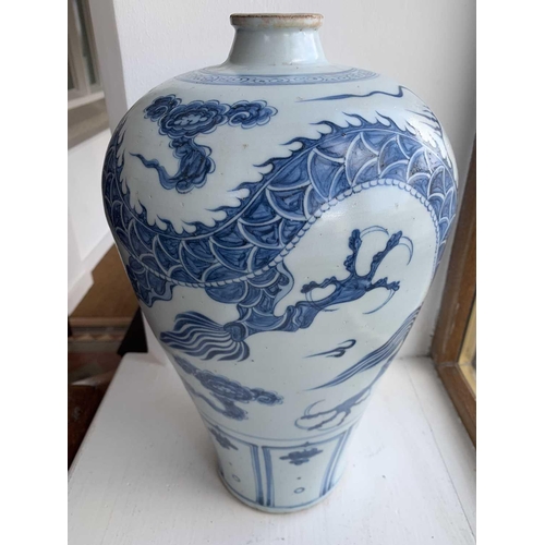 301 - A Chinese blue and white porcelain meiping, 20th century, in Yuan style, painted with a dragon among... 