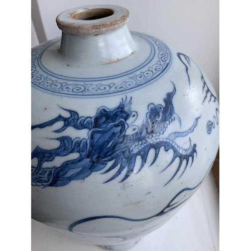 301 - A Chinese blue and white porcelain meiping, 20th century, in Yuan style, painted with a dragon among... 