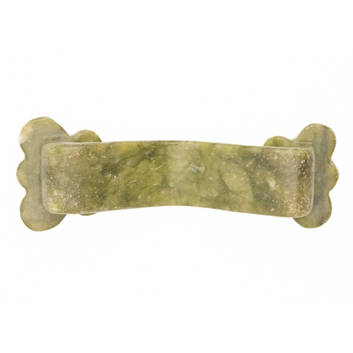 306 - A Chinese soapstone ruyi sceptre, 20th century. Carved in relief, length 11cm, width 4cm.