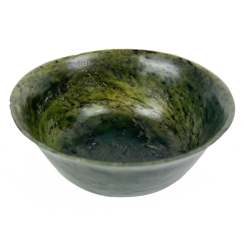 307 - A Chinese spinach jade bowl. Height 5cm, diameter 10cm.