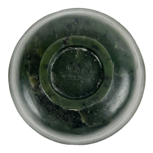 307 - A Chinese spinach jade bowl. Height 5cm, diameter 10cm.