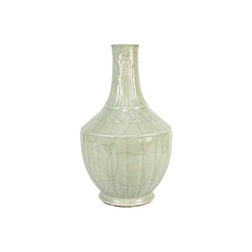 31 - A Chinese crackle glazed celadon vase, 19th century. In the Ming style, with a fluted tapering body,... 