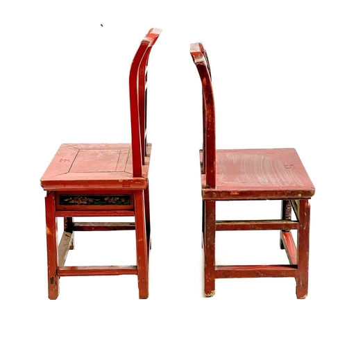 324 - Four Chinese red stained and lacquered side chairs, mid 20th century. Each with a carved splat above... 