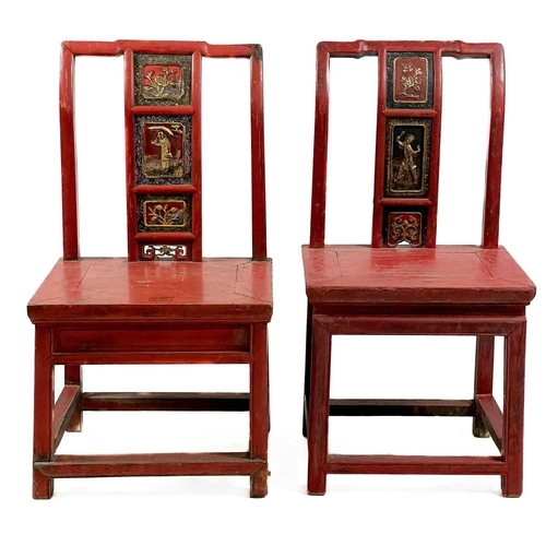 325 - Four Chinese red stained and lacquered side chairs, mid 20th century. Each with a carved splat above... 