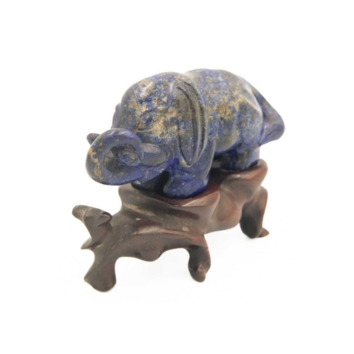 329 - A Chinese lapis lazuli model of an elephant on stand, Qing Dynasty, 19th century. Height of elephant... 