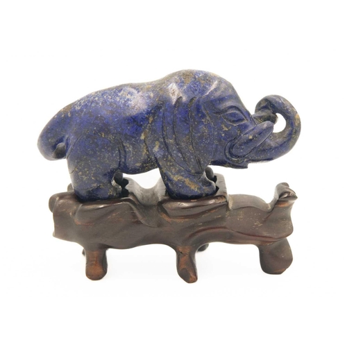 329 - A Chinese lapis lazuli model of an elephant on stand, Qing Dynasty, 19th century. Height of elephant... 