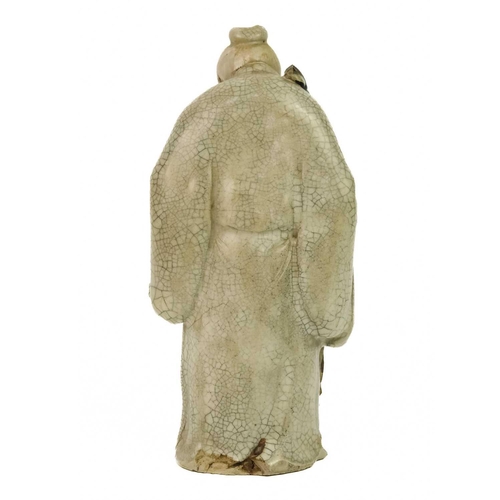 344 - A Chinese Shiwan figure of a mudman and child, Qing Dynasty, 19th century. Signature to base, height... 