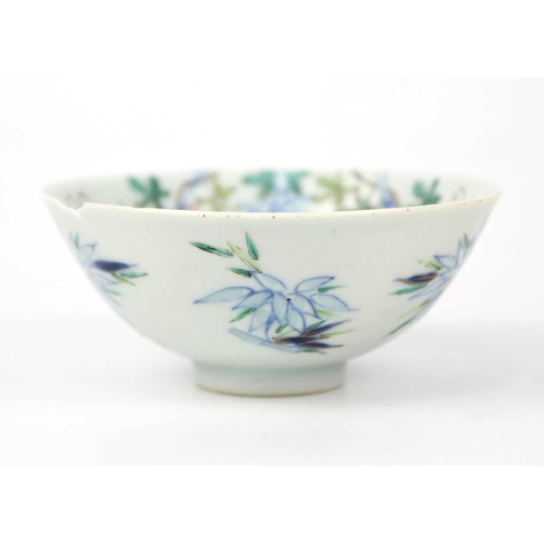 37 - A Chinese famille rose porcelain bowl, 19th century. Floral and bamboo decorated, Qianlong mark to b... 