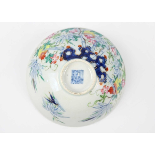 37 - A Chinese famille rose porcelain bowl, 19th century. Floral and bamboo decorated, Qianlong mark to b... 