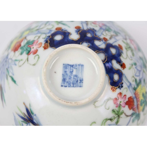 37 - A Chinese famille rose porcelain bowl, 19th century. Floral and bamboo decorated, Qianlong mark to b... 