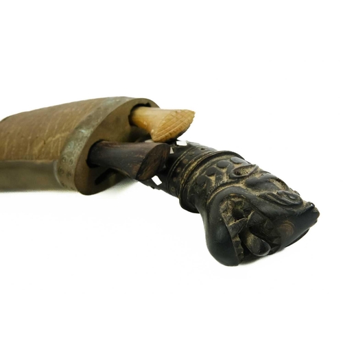 379 - A Nepalise Kukri, early 20th century. With carved wood grotesque mask handle and acanthus leaf engra... 