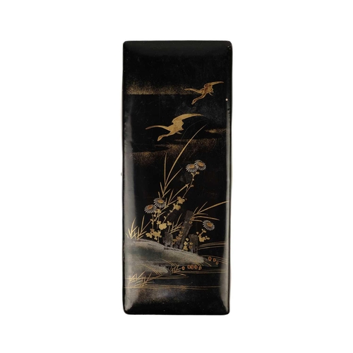 382 - A Japanese miniature lacquer cabinet, Meiji period. The pair of hinged panelled doors each decorated... 