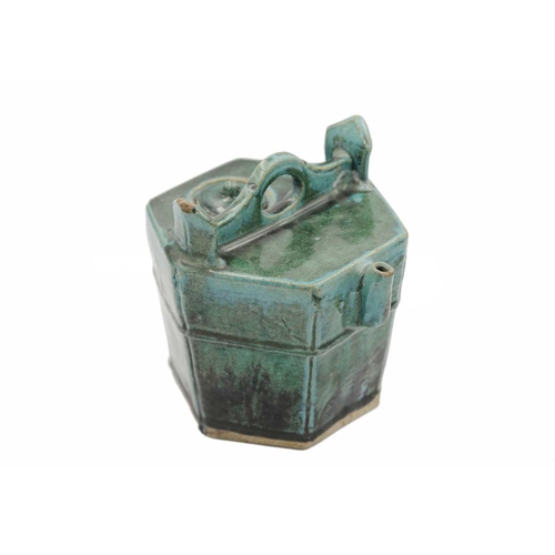 43 - A Chinese Shiwan pottery green-glazed teapot, 19th century. Height 20cm, width 19.5cm, depth 19.5cm.