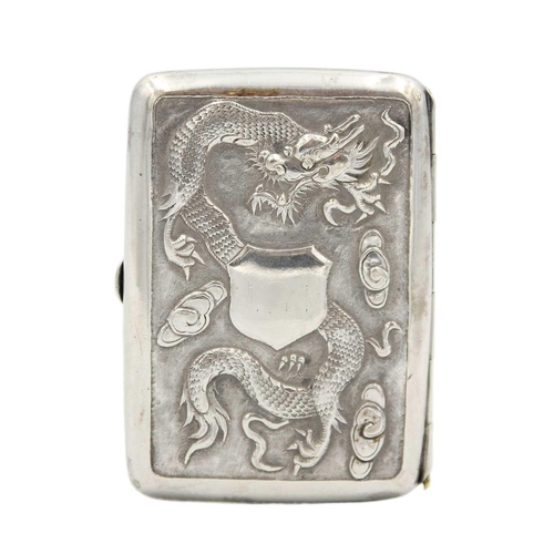 448 - A Chinese silver cigarette case, early 20th century. Repousse decorated with a central shield motif,... 