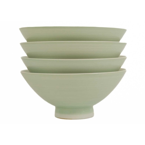 453 - Four Chinese celadon glazed porcelain dishes, 20th century. Height 5.3cm, diameter 12cm. (4)