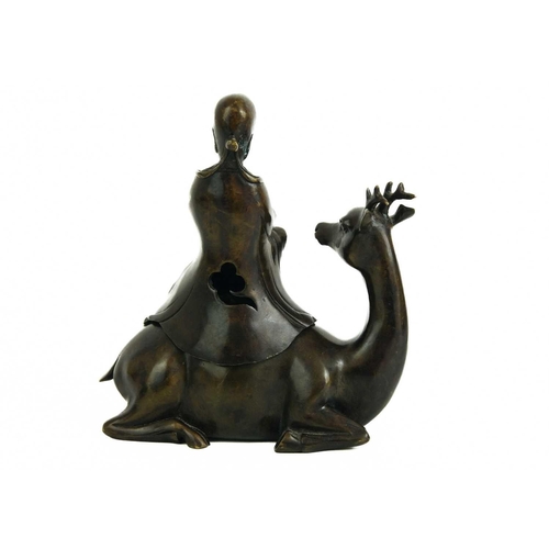 468 - A Chinese bronze incense burner, late 19th century. Depicting Shou Lao seated on a deer, height 20cm... 