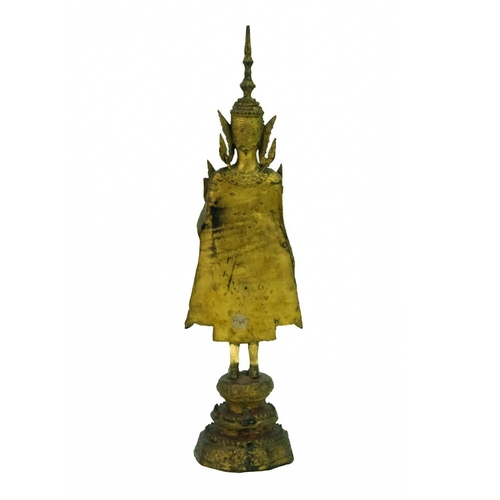 54 - A Thai gilt bronze standing Buddha in royal attire, 18th/19th century. With left hand raised and sta... 