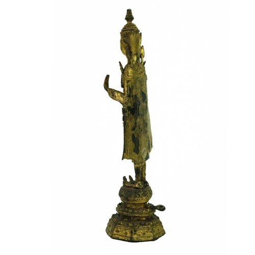 55 - A Thai gilt bronze standing Buddha in royal attire, 18th/19th century. With both hands raised and st... 