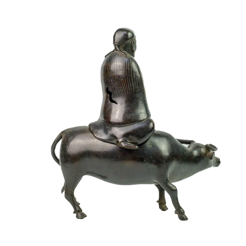 57 - A Chinese bronze figural incense burner, 19th century. Modelled as a separately cast figure on a buf... 