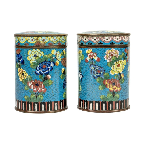 58 - A pair of Chinese cloisonne cylindrical jars and covers, early 19th century. Each with a pale blue g... 