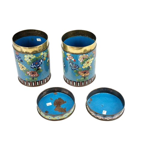 58 - A pair of Chinese cloisonne cylindrical jars and covers, early 19th century. Each with a pale blue g... 