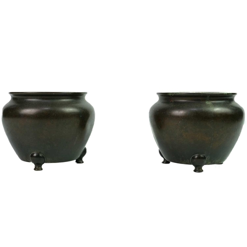 59 - A pair of Chinese bronze censers, Qing Dynasty. Each with a circular tapering body, on three shaped ... 