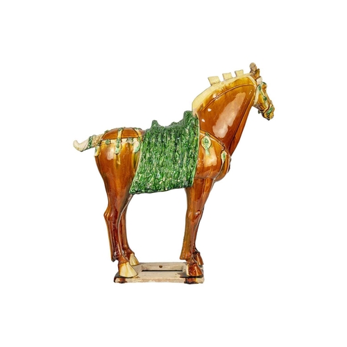 608 - A large Chinese Tang style sancai model of a horse. Height 58cm, length 54cm, depth 22cm.