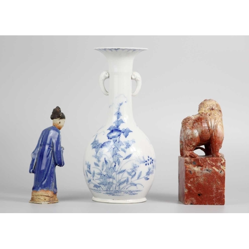 609 - A Chinese blue glazed pottery figure of a tomb attendant holding a scroll. Height 15cm, width 4.5cm;... 