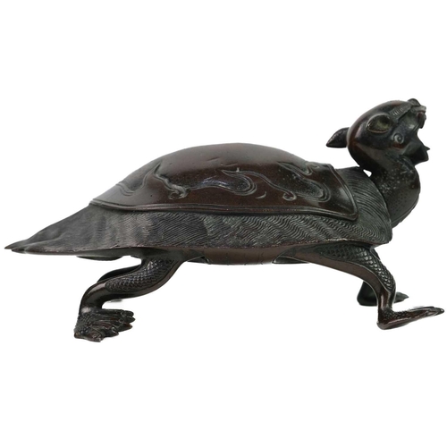 61 - A Chinese bronze model of a turtle, 19th century. Of Longevity and Tenacity, upturned stylized head,... 